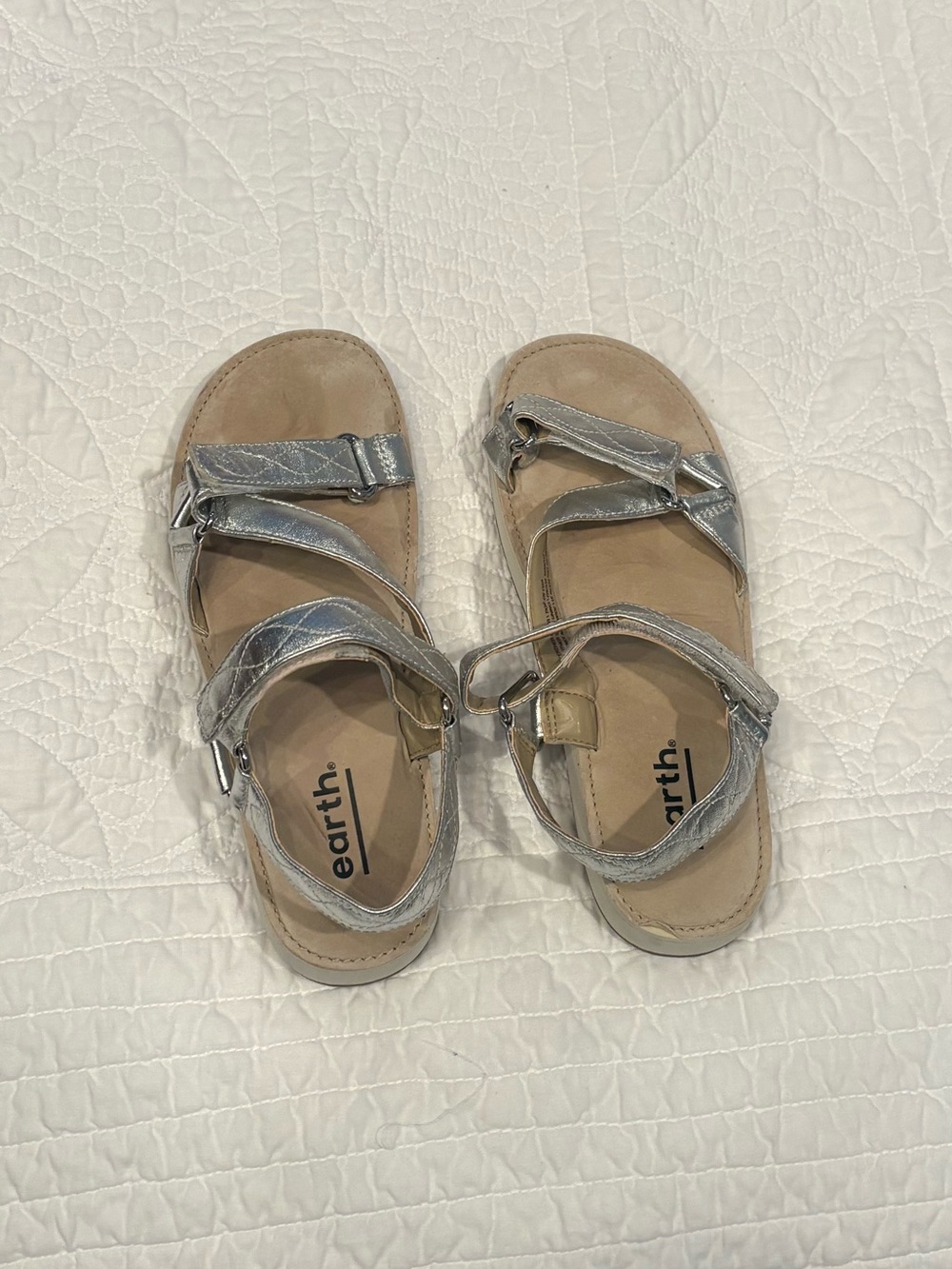 Earth metallic sandals
